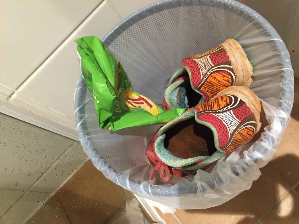 Goodbye faithful shoes! And yes there's a chip packet - salt is helpful after a marathon! ?